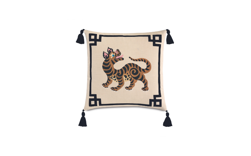 Eastern Accents’ Guster tassel decorative pillow is hand-painted with a Chinoiserie-inspired tiger design on the face and crafted from weather-resistant fabric. easternaccents.com